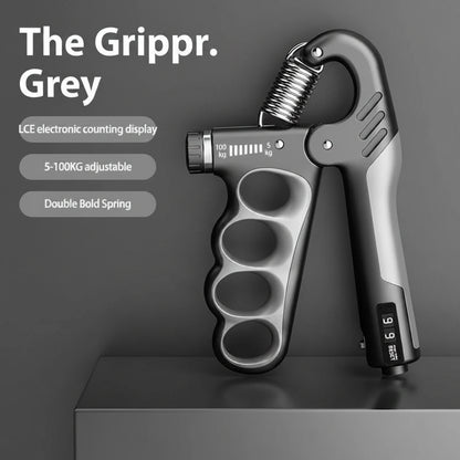 Mechanical counting gripper with electronic display on a dark background